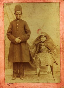 A young aristocrat posing next to her personal African eunuch. Photograph: Unknown photographer/Central Library, University of Tehran, Tehran, Iran 