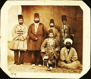Muzaffar al-Din Mirza (Muzaffar al-Din Shah Qajar 1853-1907) accompanied by his entourage. Prince Muzaffar Mirza’s high-ranking African slave (khajeh) is standing on his right, possibly in Tabriz, Iran, 1880s. Photograph: Unknown court photographer/Central Library, University of Tehran, Tehran, Iran 