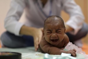  A baby born with microcephaly reacts to stimulus during an evaluation session with a physiotherapist at the Altino Ventura rehabilitation center in Recife, Brazil on January 28, 2016. (Ueslei MarcelinoReuters)