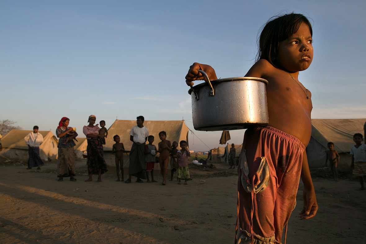 24 November, 2012: A young Rohingya girl carries water to her tent at a IDP camp on the outskirts of Sittwe, MyanmarPaula Bronstein/ Getty Images 