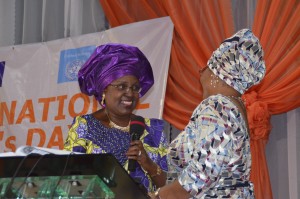 Representative of UN Women, Nigeria welcoming Mrs. Fayemi to the podium.