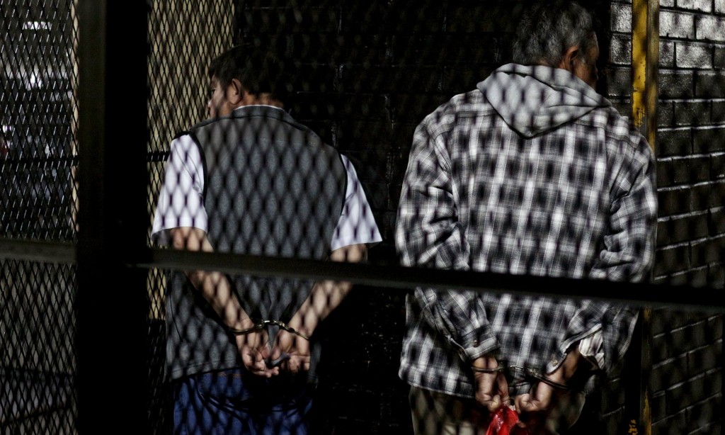  Esteelmer Reyes Girón and Heriberto Valdez Asij stand handcuffed after the verdict was given in the Sepur Zarco case in Guatemala City. Photograph: Josue Decavele/Reuters 
