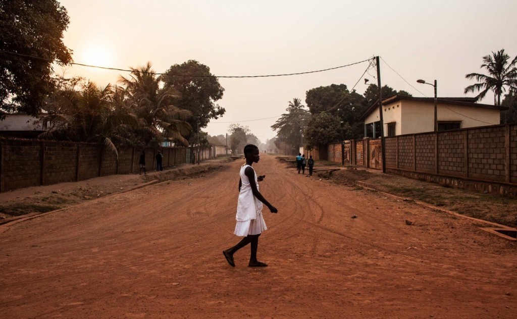  A young girl walks through the Castors neighborhood of Bangui in the Central African Republic. Photos by Jane Hahn 