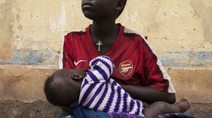 A  14-year-old breast-feeds her 3-month-old son in Bangui, Central African Republic. She says she was raped and made pregnant by a U.N. peacekeeper from Burundi.