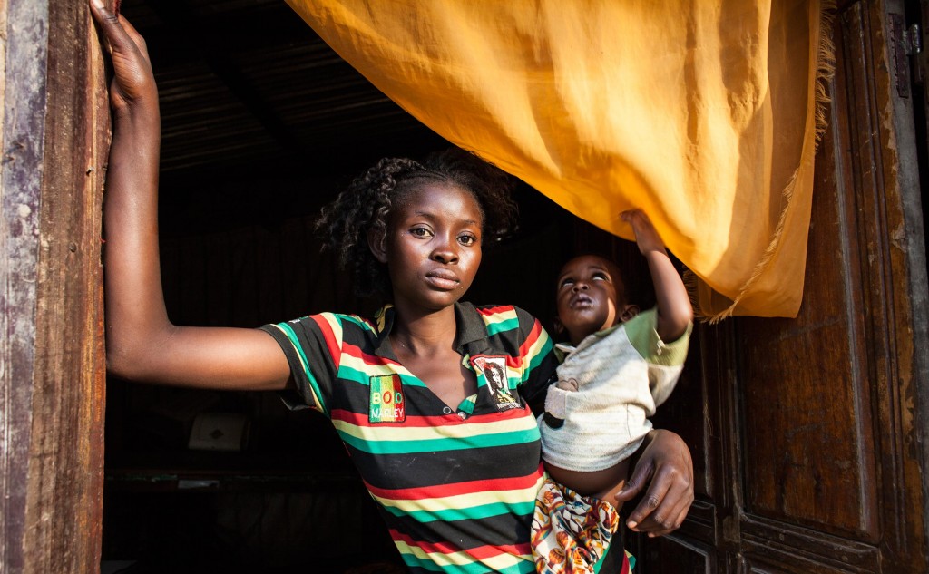Bangui, CAR- Rosine Mengue, 18, holds her 1-year-old son in her home in the Castors neighborhood in Bangui, Central African Republic on Sunday, February 14, 2016. She says she was 16 when a Moroccan peacekeeper coerced her into sex for money, paying her a total of $8 for two visits and making her pregnant. (Jane Hahn for the Washington Post)