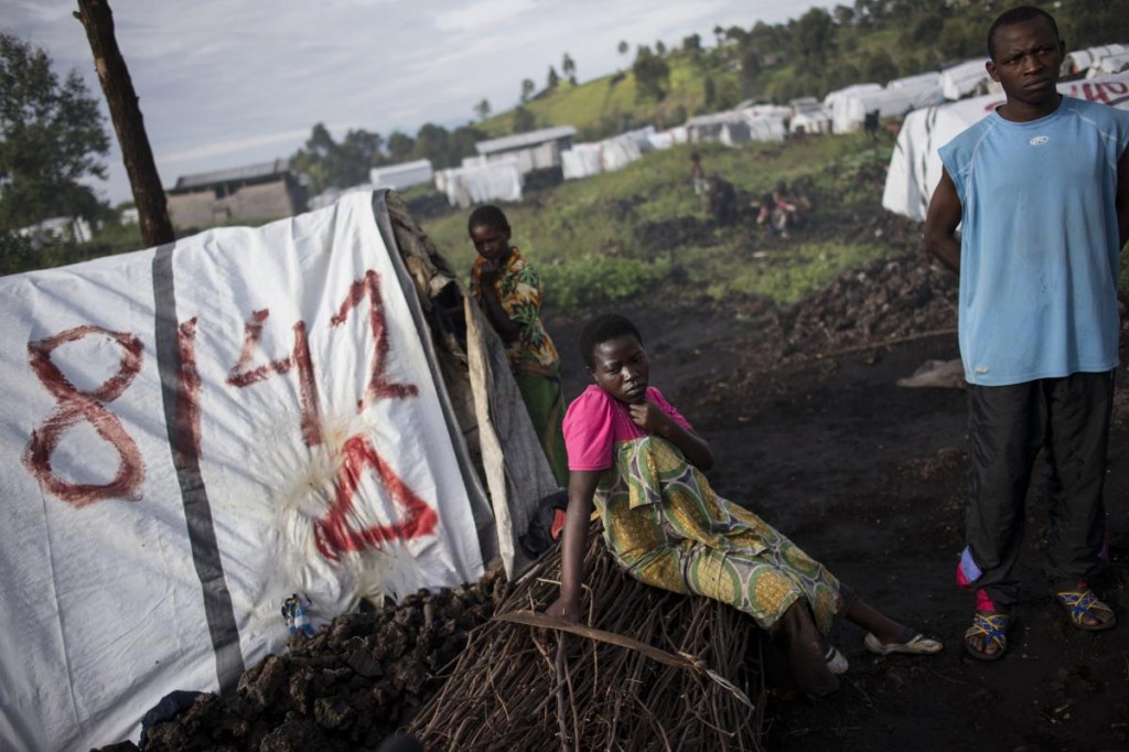Congolese internally displaced Maiombi Thomas,16 years, from Kichanga sits pregnant alongside her brother, Innocent kongomani, 22, in the Mugunga 1 camp outside of Goma, in the Democratic Republic of Congo, December 5, 2015. Maiombi was raped by a ranger when she went to get firewood outside the camp.  As the world takes more notice of rape being used as a weapon of war, congos dark history of sexual violence in conflict has much to teach the world on how to prevent rape, and how it can help survivors heal physically, emotionally, and socially.  (Credit: Lynsey Addario for Time Magazine)