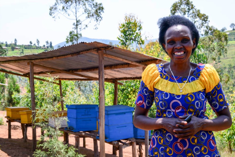 WfWI-Rwanda graduate Caritas at her beekeeping cooperative Abafitintego. Photo credit: Harriet Tolputt, 2016