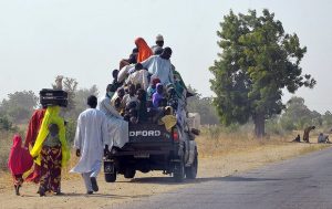 People flee from Boko Haram, in Mairi village on the outskirts of Maiduguri, Borno state. Photograph: Stringer/AFP/Getty Images 
