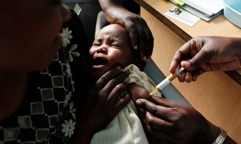 A baby receives the RTS,S vaccine as part of a trial in Kombewa, western Kenya. Photograph: Karel Prinsloo/AP