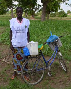 A health worker distributes malaria drugs in Burkina Faso, where malaria accounts for about half of doctor visits. Photograph: Malaria Consortium