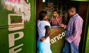 People in the Kenyan capital, Nairobi, transfer money using the M-Pesa banking service. Photograph: Bloomberg via Getty Images