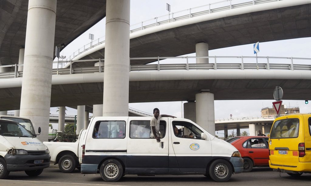 A van drives beneath the recently constructed Henri Konan Bedie bridge in Abidjan. The ratio of debt to gross domestic product in Ivory Coast is about 40%. Photograph: Joe Penney/Reuters