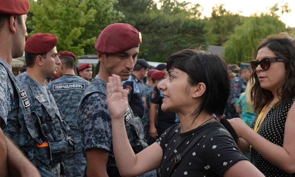 An Armenian opposition member stand in front of military forces during a protest in central Yerevan. Photograph: Karen Minasyan/AFP/Getty Images