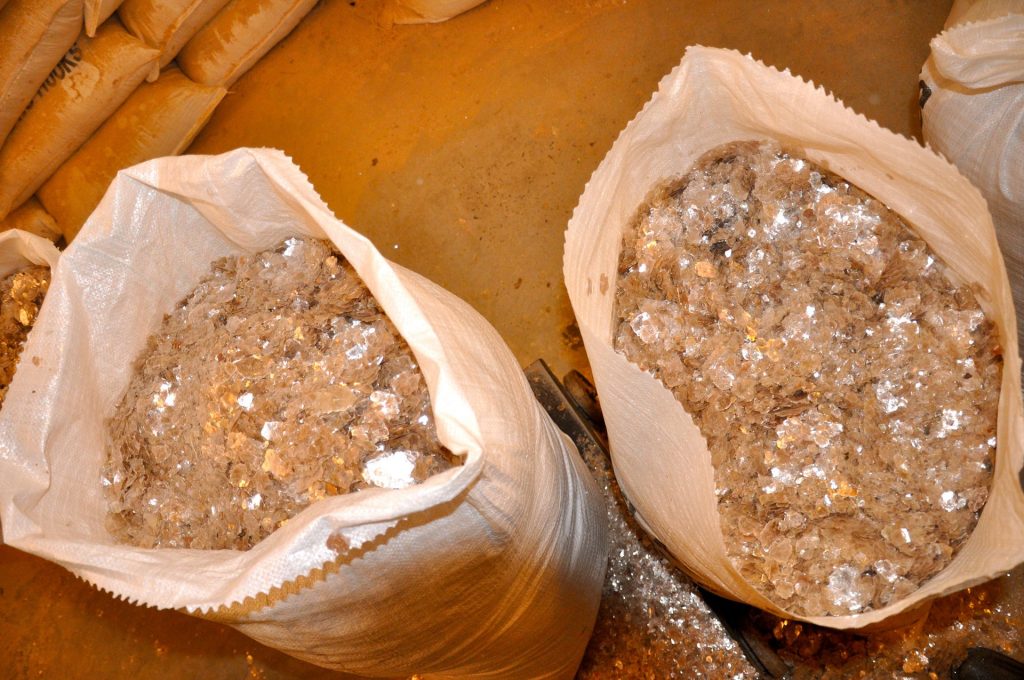  Inside a factory in Jharkhand belonging to a local mica trader, bags of the precious mineral sit ready for sorting. Photograph: Peter Bengtsen 