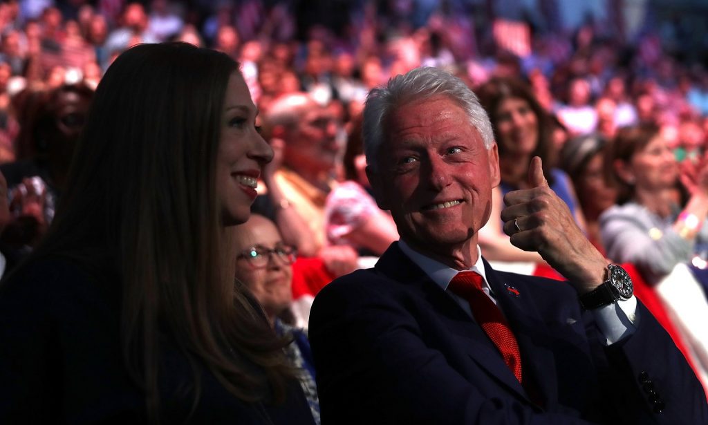 Bill Clinton gives the thumbs-up to his daughter Chelsea Clinton as Hillary delivers a speech in New York. Photograph: Justin Sullivan/Getty Images