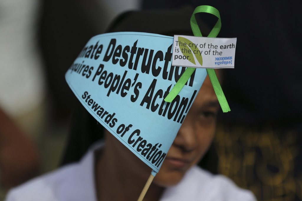 A Filipino nun joins the Climate Solidarity prayer march in Manila, Philippines, November 2015. Photograph: Aaron Favila/AP