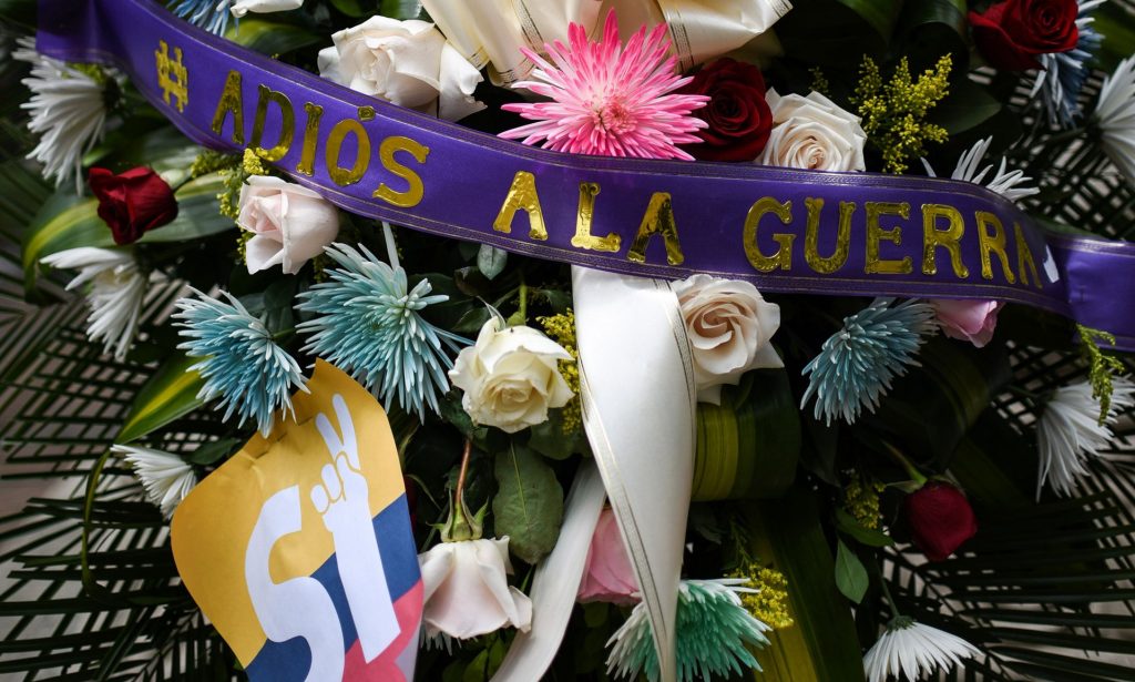A wreath in the main square in Cali, Colombia, with a ribbon reading ‘Farewell to the War’. Photograph: Luis Robayo/AFP/Getty Images