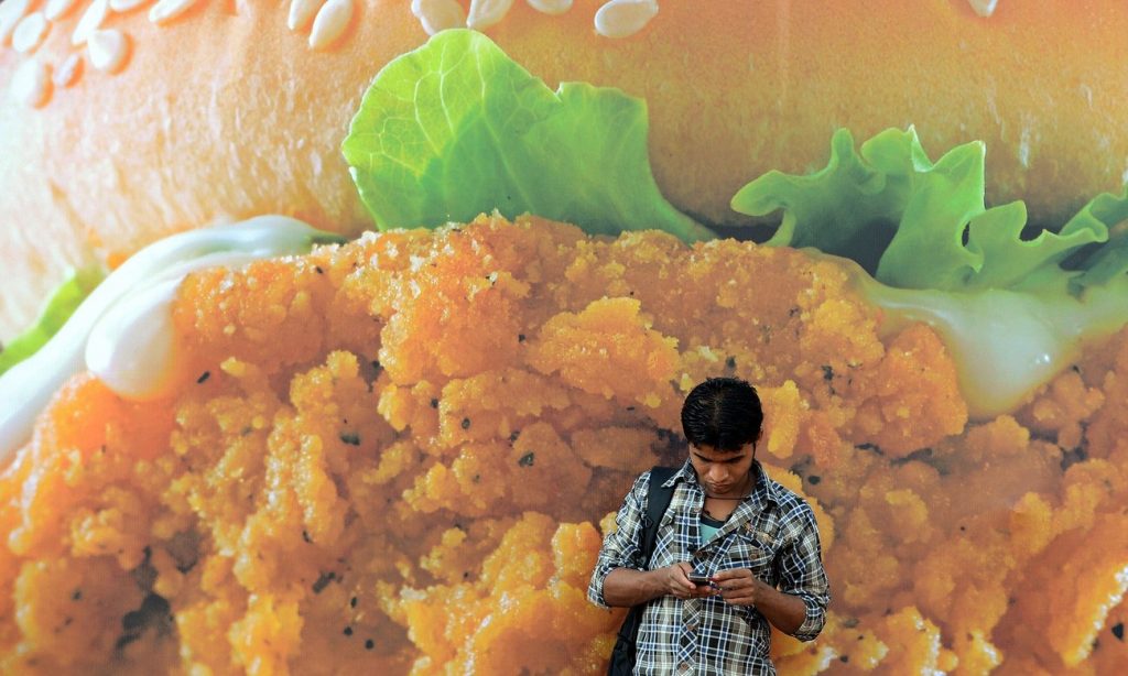  An advert for a burger in Mumbai. India ranks third in the world for obesity. Photograph: Indranil Mukherjee/AFP/Getty Images 