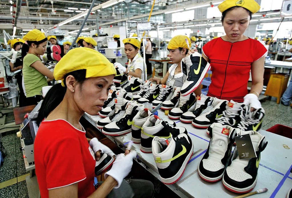 Workers on a production line in Ho Chi Minh City, Vietnam. Nine million people, mostly young women, are dependent on garment and footwear jobs in south-east Asia. Photograph: Richard Vogel/AP