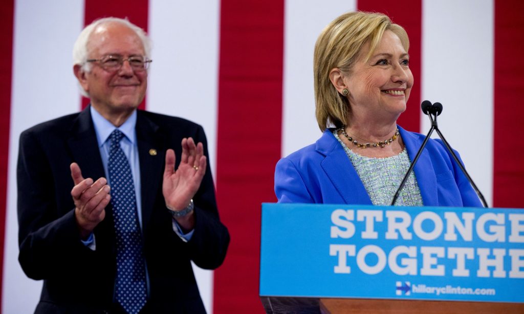 Hillary Clinton appears with former Democratic rival Bernie Sanders earlier this month. Photograph: Andrew Harnik/AP