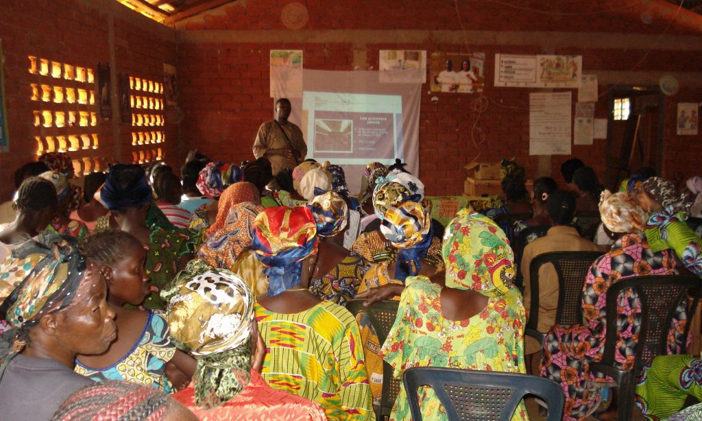 An ICC representative at a town hall meeting with women’s groups in Bossembélé, Central African Republic, in 2010. Photograph: Courtesy of ICC