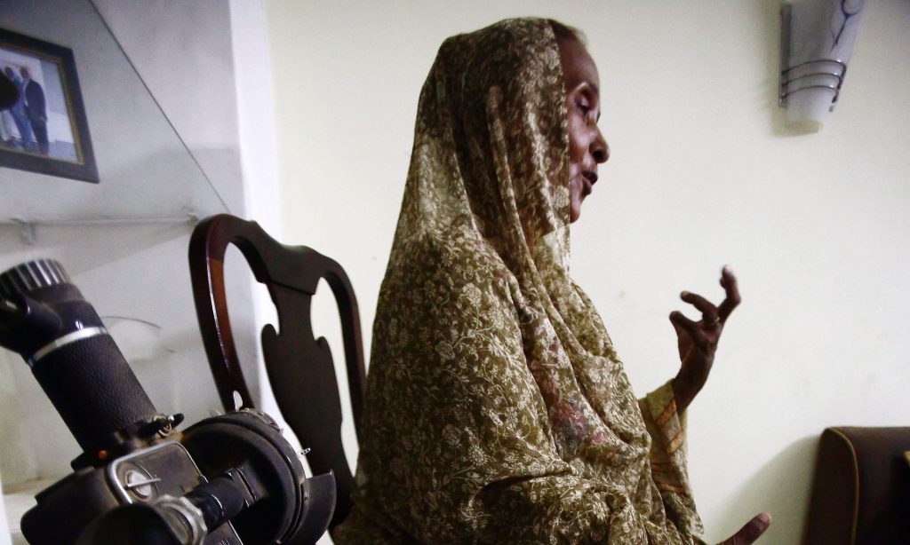 Sara Jadallah, the daughter of legendary Sudanese filmmaker Jadallah Jubara, speaks at her house in Khartoum. Photograph: Ashraf Shazly/AFP/Getty Images