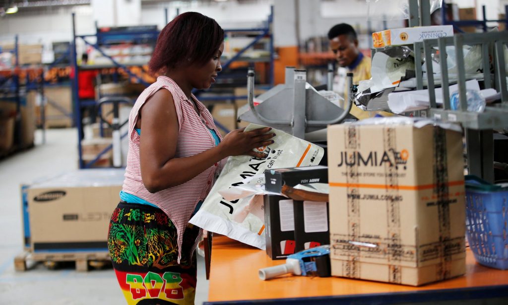 An employee in the packaging unit at a Jumia warehouse in Ikeja district, Lagos. Photograph: Akintunde Akinleye/Reuters