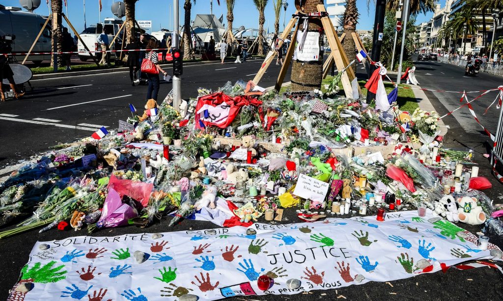 Flowers and written tributes are laid on the Promenade des Anglais. Photograph: Ben Birchall/PA