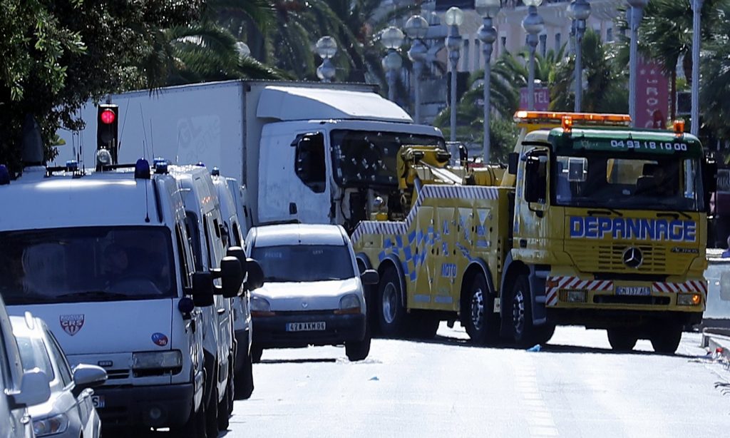 The truck used by the attacker in Nice is towed from the scene. Photograph: Francois Mori/AP