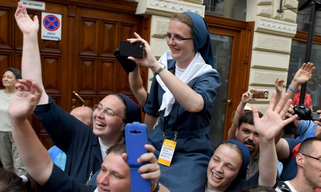  Nuns take pictures of Pope Francis arriving at Wawel cathedral. Photograph: Janek Skarzynski/AFP/Getty Images 