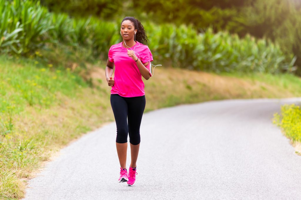 African american woman runner jogging outdoors - Fitness, peopl