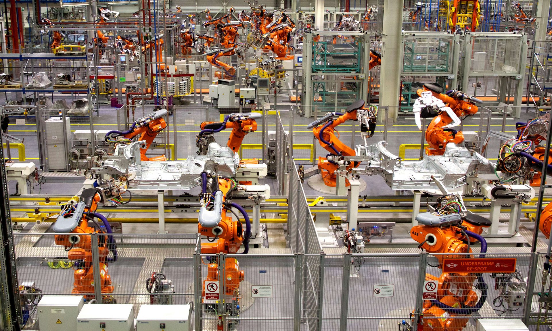 Robots ready to produce the new Mini Cooper at BMW’s plant at Cowley in Oxford. Minis use parts made in Germany. Photograph: Andrew Cowie/AFP/Getty Images