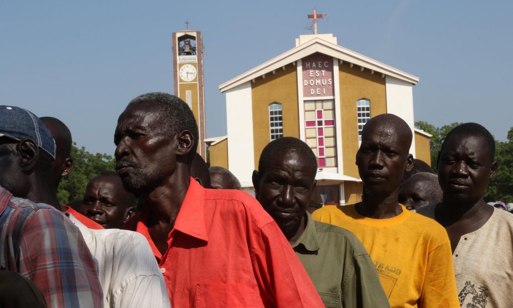 Displaced people line up to receive aid at St Theresa’s cathedral in Juba, where more than 2,000 people are seeking shelter. Photograph: Simona Foltýn