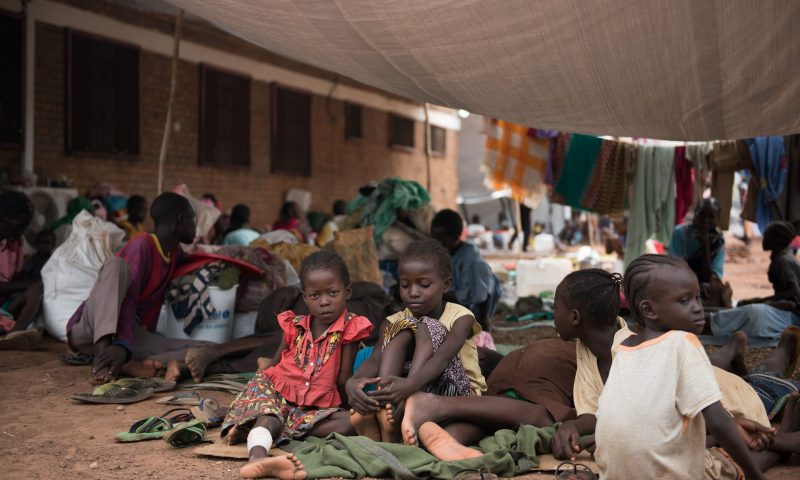 Children wait to be registered among the displaced in a South Sudan Red Cross compound in Wau, where violence broke out in breach of a peace deal. Photograph: Charles Lomodong/AFP/Getty Images