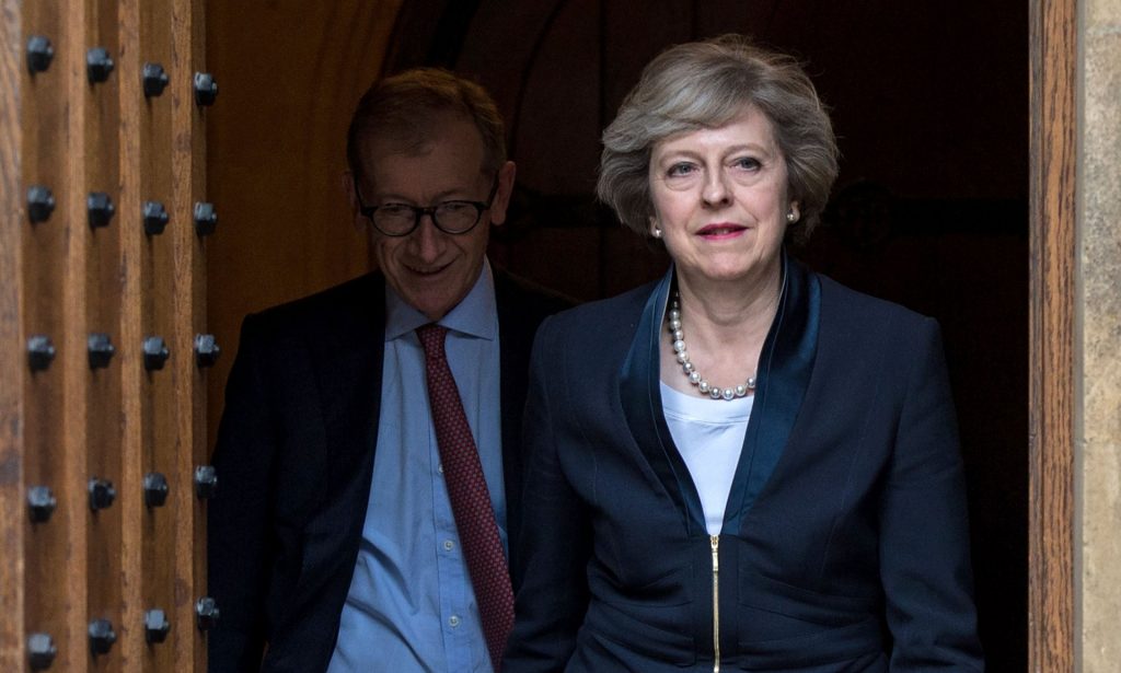 Theresa May, with her husband Philip John May, comes out to speak to the media at Westminster on Monday. Photograph: Chris Ratcliffe/AFP/Getty Images