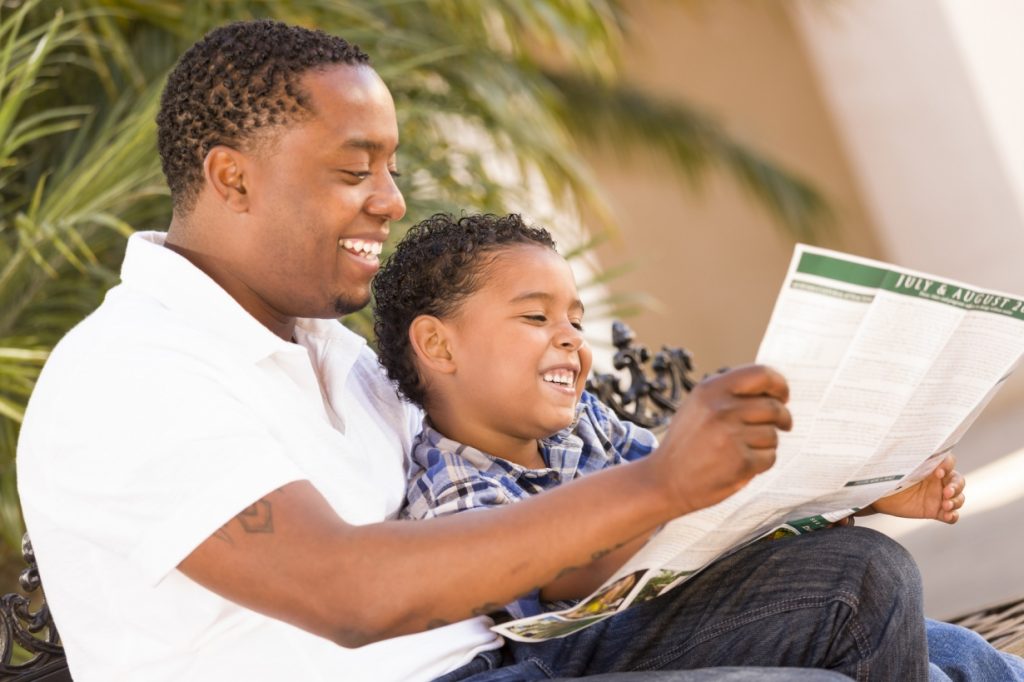 father reading to son