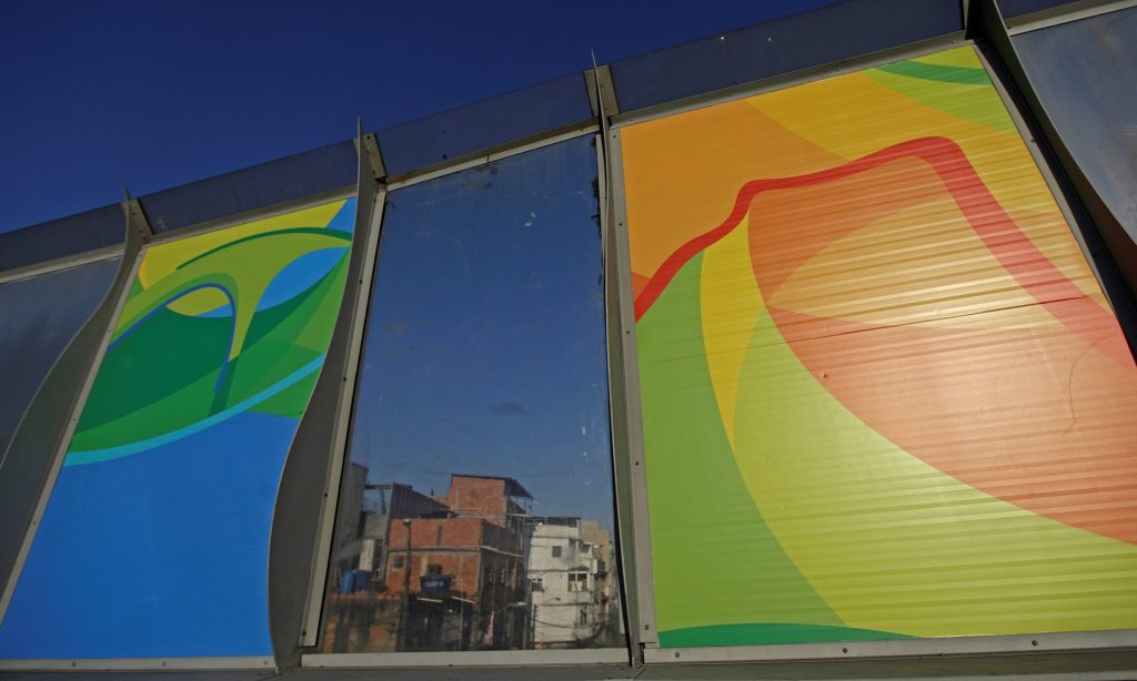 Banners (left and right) advertise the 2016 Rio Olympics. In the background is the Maré slum complex. Photograph: Ricardo Moraes/Reuters