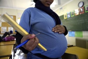 TO GO WITH AFP STORY BY SIBONGILE KHUMALO A pregnant student poses on July 29, 2013 in Pretoria at the Pretoria Hospital School specialised in teenage pregnancy. The Pretoria Hospital School, a Public School opened in 1950 and originally dedicated to sick children, is the only school of its kind in South Africa. AFP PHOTO / STEPHANE DE SAKUTIN (Photo credit should read STEPHANE DE SAKUTIN/AFP/Getty Images)
