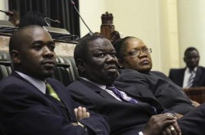 Zimbabwe Vice President Joice Mujuru (R), Prime Minister Morgan Tsvangirai (C) and member of the House of Assembly of Zimbabwe for Kuwadzana Nelson Chamisa attends the presentation of the Final Draft of the Constitution for debate in Parliament Building in Harare, February 6, 2013. REUTERS/Philimon Bulawayo