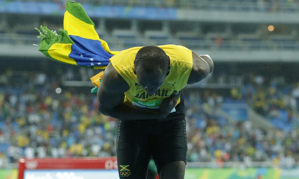 Usain Bolt accepts the crowds applause. Photograph: Tom Jenkins for the Guardian
