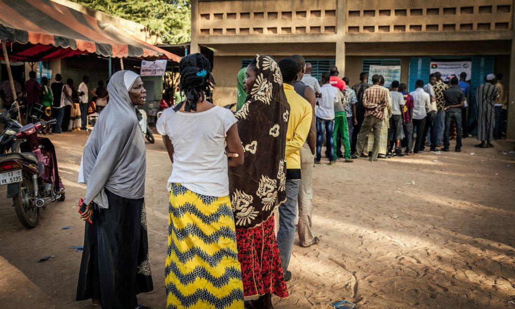 People queue to vote in Burkina Faso’s general election. A mobile phone app helped voters follow the results in real time. Photograph: Wouter Elsen/EPA