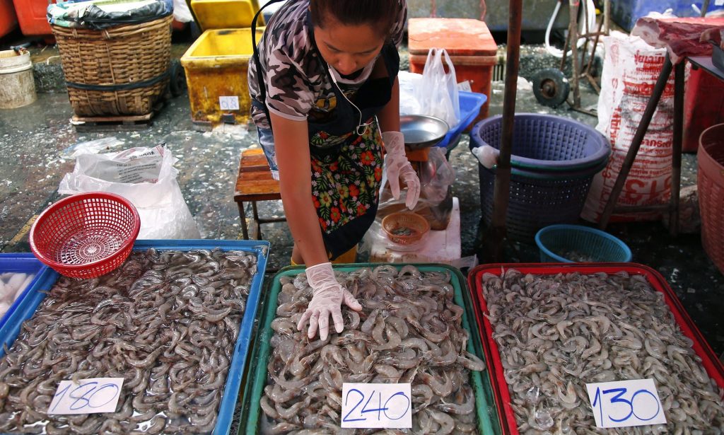 A female worker sorts shrimp at Klong Toey fresh food market in Bangkok. Photograph: Barbara Walton/EPA