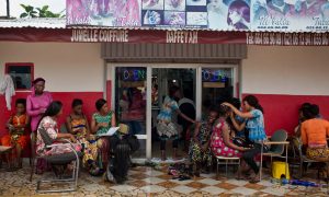 Female clients at the Jumelle Coiffure hair salon in Conakry benefit from free contraceptives as well as family planning advice dispensed by apprentice hairdressers trained as community health workers. Photograph: Kate Holt