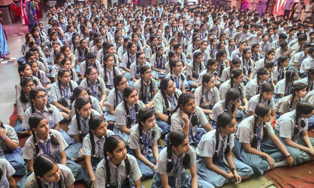 Girls listen to police officers talk about reporting sexual abuse, at a public school in Delhi. Photograph: Amrit Dhillon 