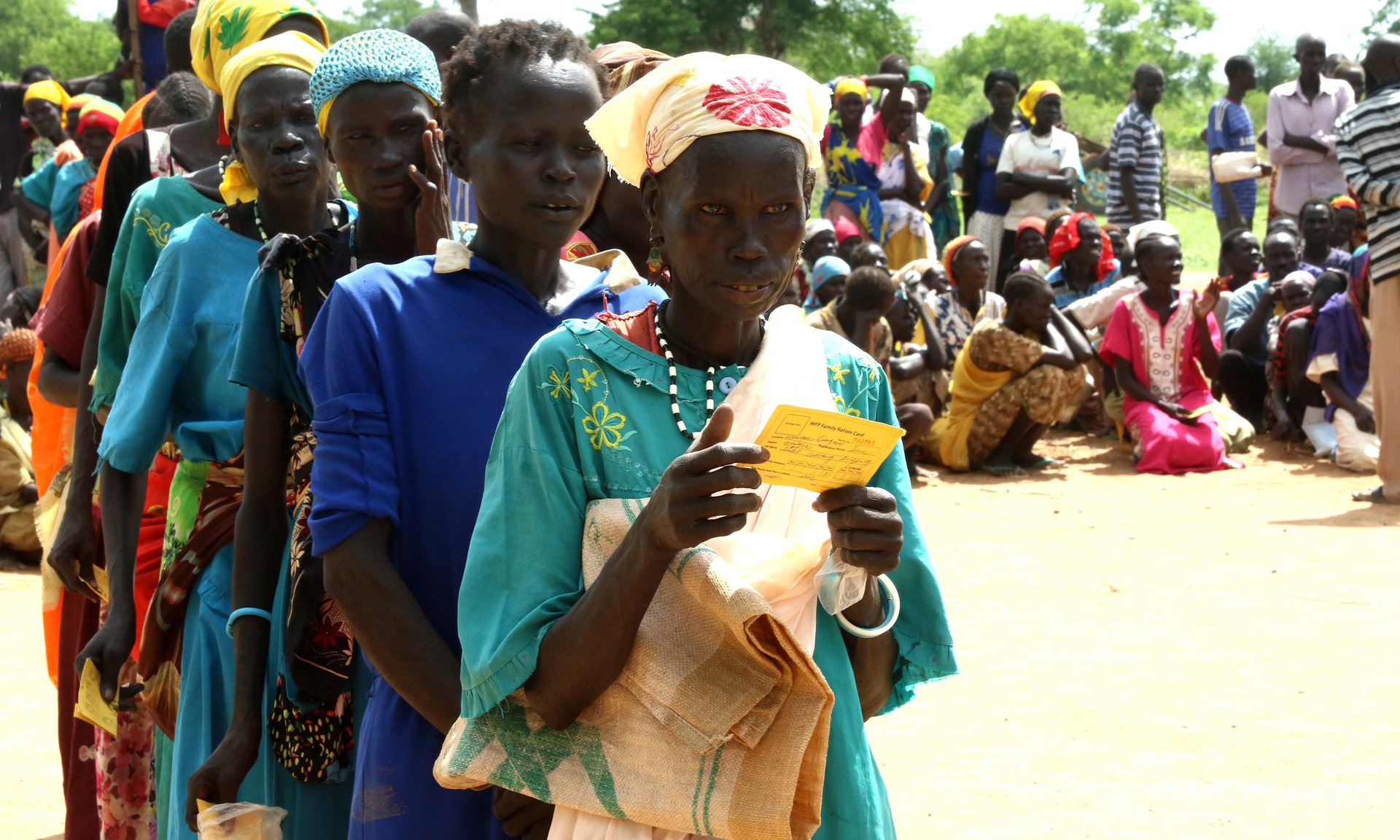 People line up for food distributions near the town of Aweil in Northern Bahr el Ghazal. Although largely unaffected by the conflict, the region has recorded high malnutrition rates. Photograph: Simona Foltyn