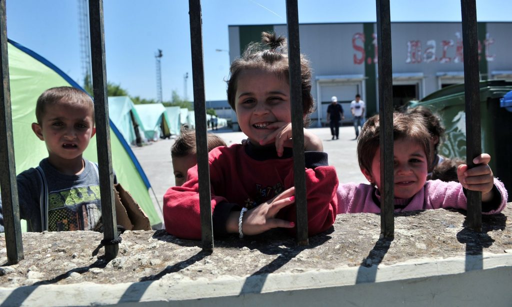 Children inside a camp for refugees and migrants in an abandoned factory in Thessaloniki. Photograph: Sakis Mitrolidis/AFP/Getty Images