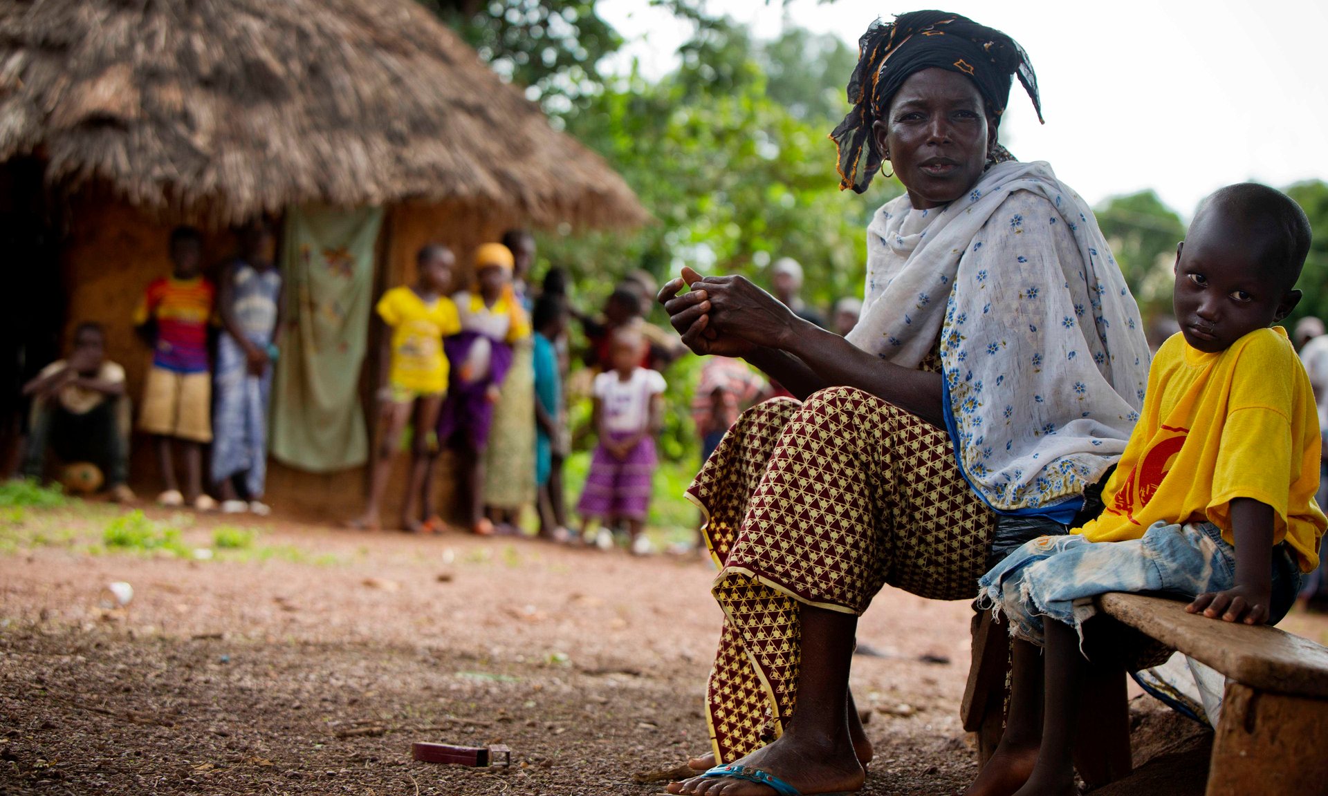 Sita Aidara sits beside her grandson, Lounceny, who contracted polio at two years old. Healthcare in Guinea was crippled by the Ebola epidemic, leaving it vulnerable to a subsequent polio outbreak. Photograph: Kate Holt/Unicef