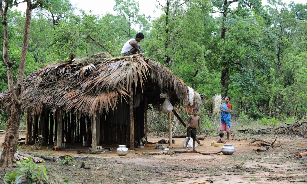 A family builds a shelter in Khammam district, having fled the Maoist insurgency-hit Chhattisgarh state. Photograph: Noah Seelam/AFP/Getty Images