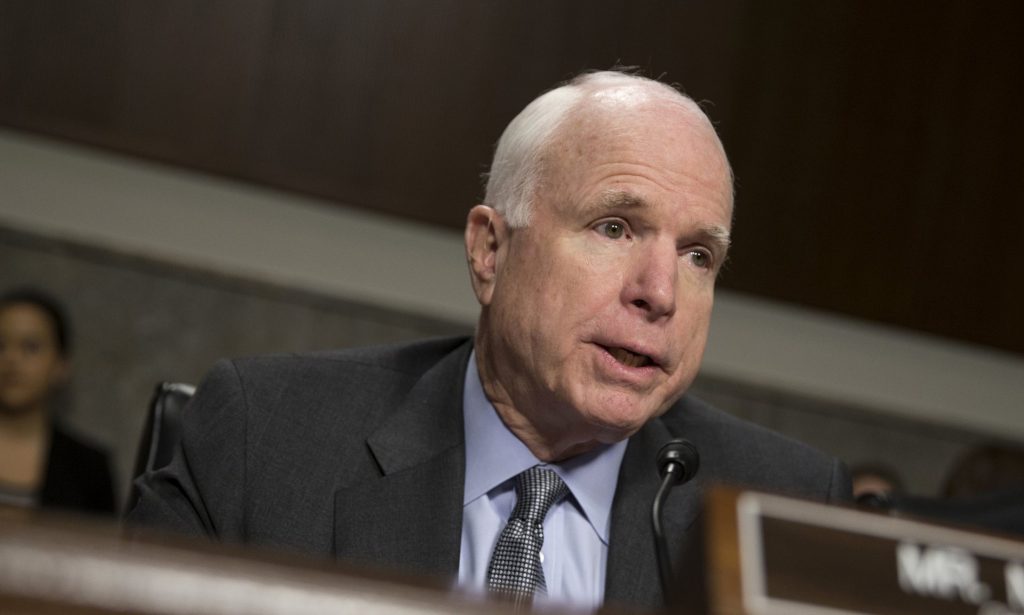 John McCain called on Donald Trump to ‘set an example’. Photograph: Evan Vucci/AP