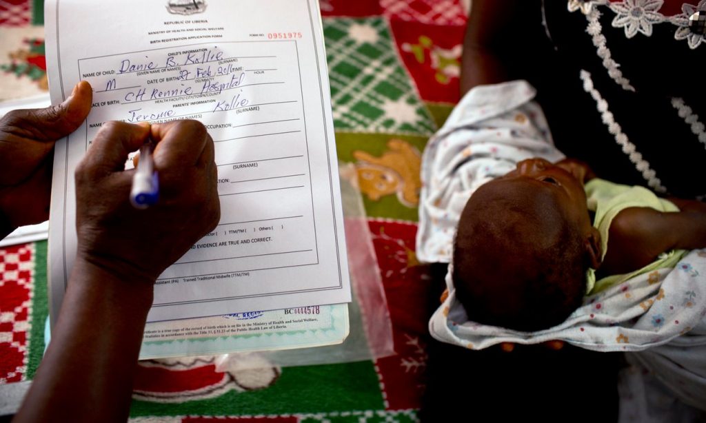 A registrar takes details in order to register a baby’s birth at the Kakata Rennie hospital in Margibi, Liberia. All photographs by Kate Holt 